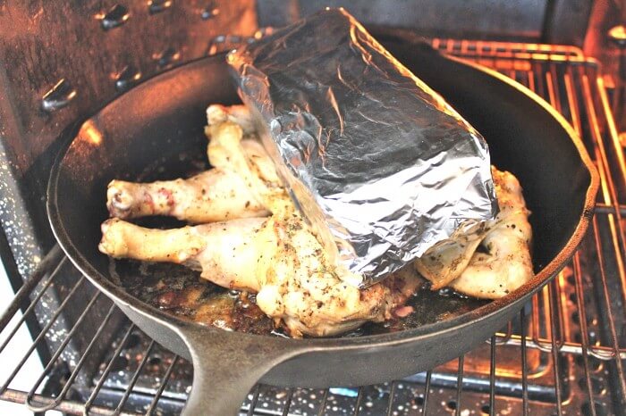 put the chicken with the brick into the oven