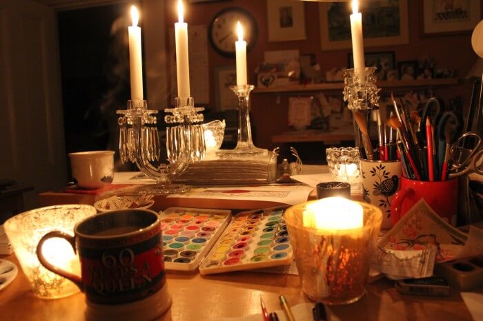 working by candle light